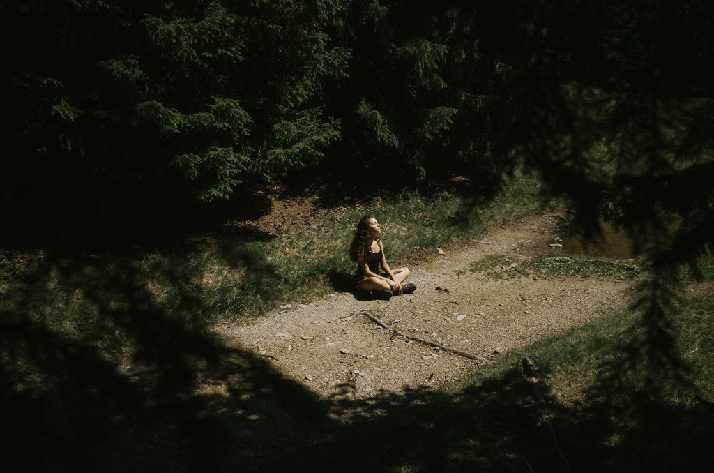 Nature Immersions Guided Forest Bathing and Nature-Based Wellbeing in Singapore Full Length Woman Sitting Field Amidst Trees